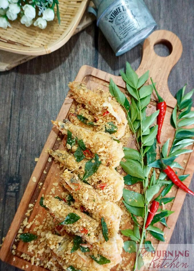 Cereal butter prawns on wooden board