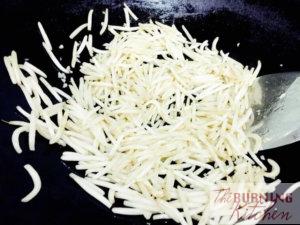 frying bean sprouts in wok