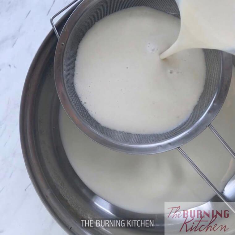 Sieving blended soy beans through strainer