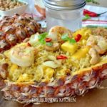 Thai Pineapple Fried Rice: With a plethora of flavours and textures ranging from sweet, savoury, spicy, crunchy to fluffy, this one-pan crowd-pleaser rice recipe has it all! Made using fresh pineapple and served in a beautiful pineapple boat.