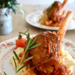 Braised Rosemary Lamb Shank: This lamb shank is braised in a hearty sauce of tomatoes, rosemary, onions and leek for 2 hours until fork-tender, and then served on a bed of mashed potatoes, and topped with cherry tomatoes on vine. A dinner party-worthy dish that requires only 45 minutes of active time!