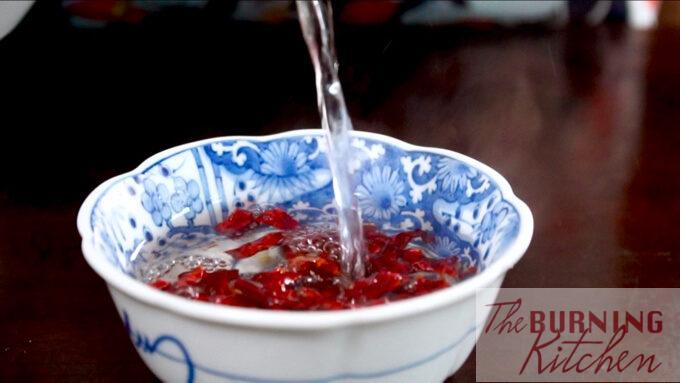 Soaking the dried chilli in hot water